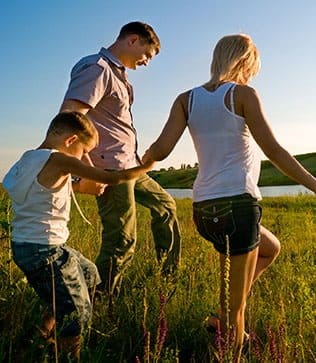 Family enjoying optimal health outside