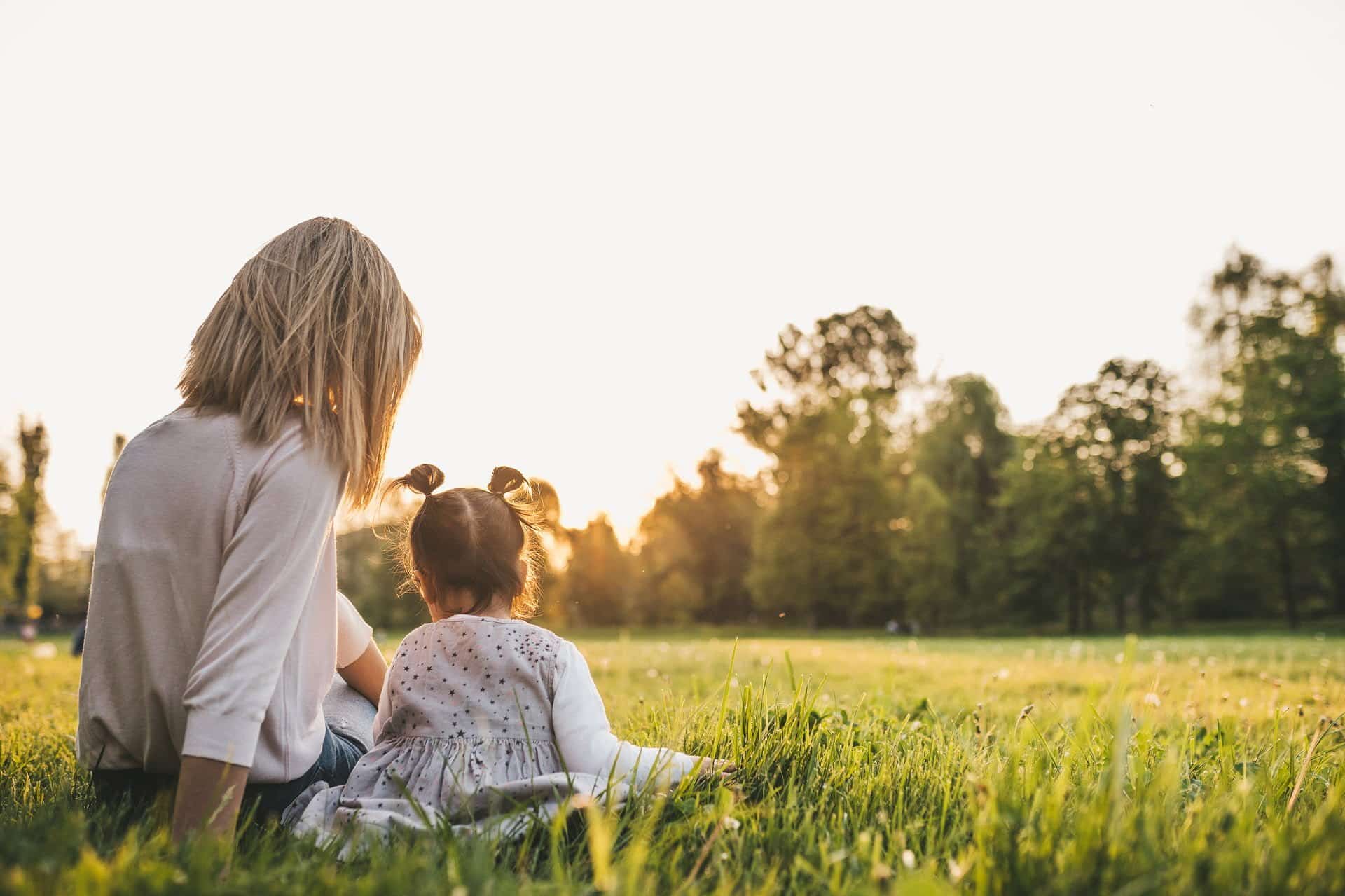 mom and kid looking into the sun