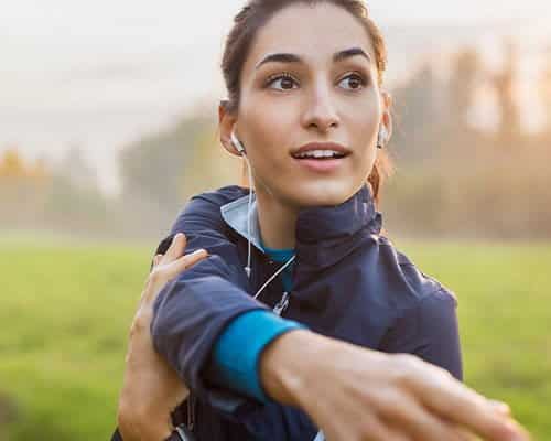 Fit woman stretching